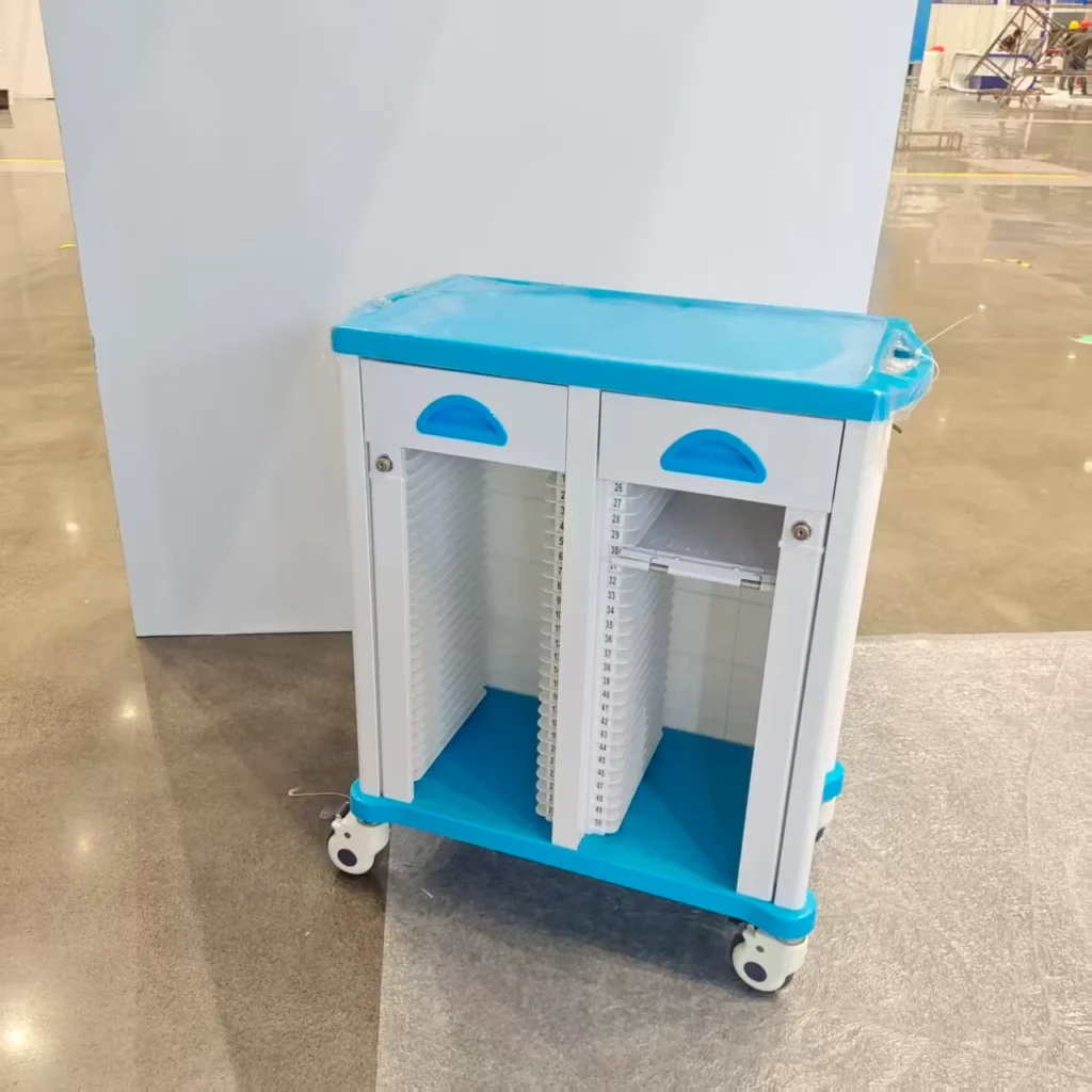 Blue and white medical storage cart with wheels on a polished floor, featuring compartments for organization.