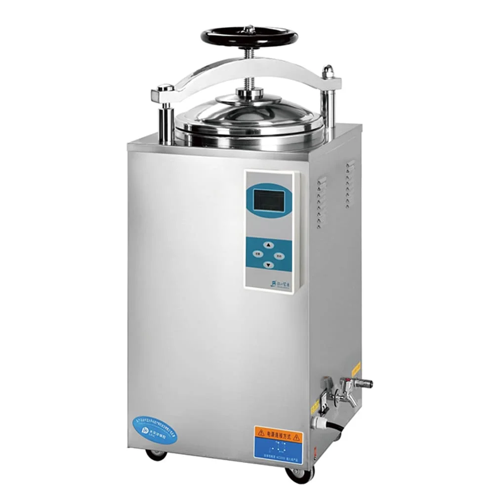 Silver industrial autoclave machine with a circular lid, control panel, and valve attachments.