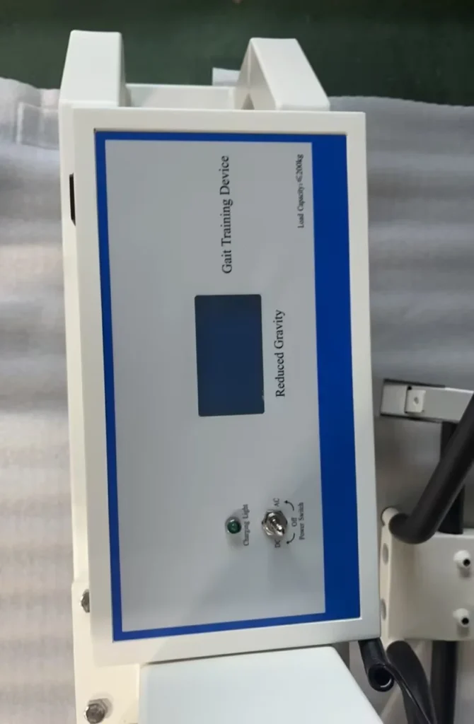 Control panel of a gait training device with controls and display, labeled for reduced gravity functionality.