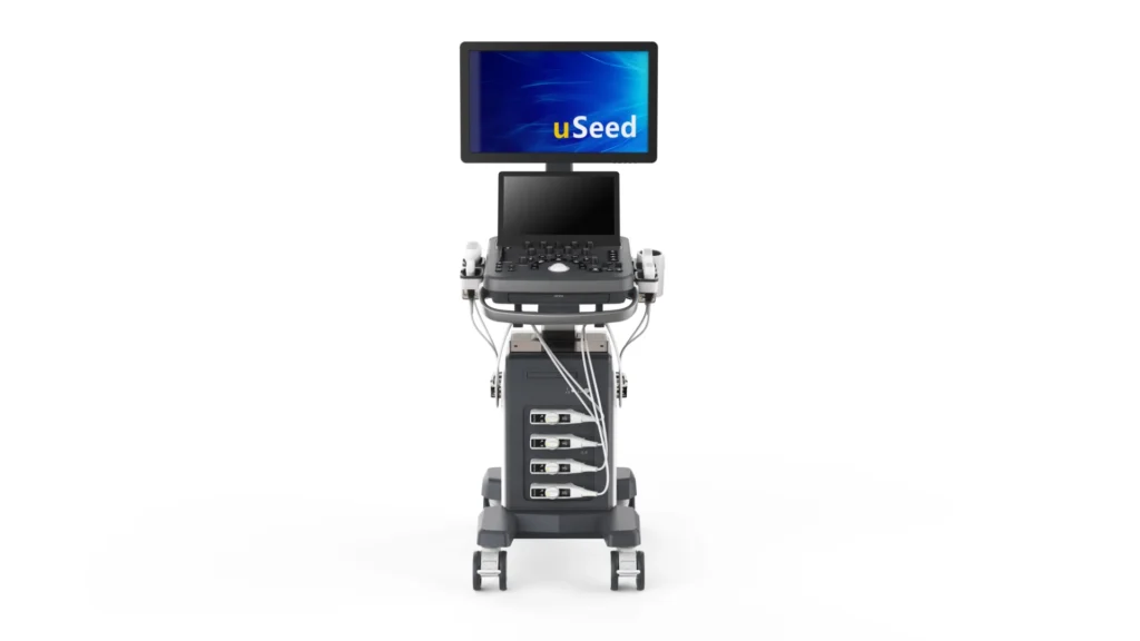 Front view of a modern ultrasound machine on wheels with a screen displaying the uSeed logo, cables, and probes attached.