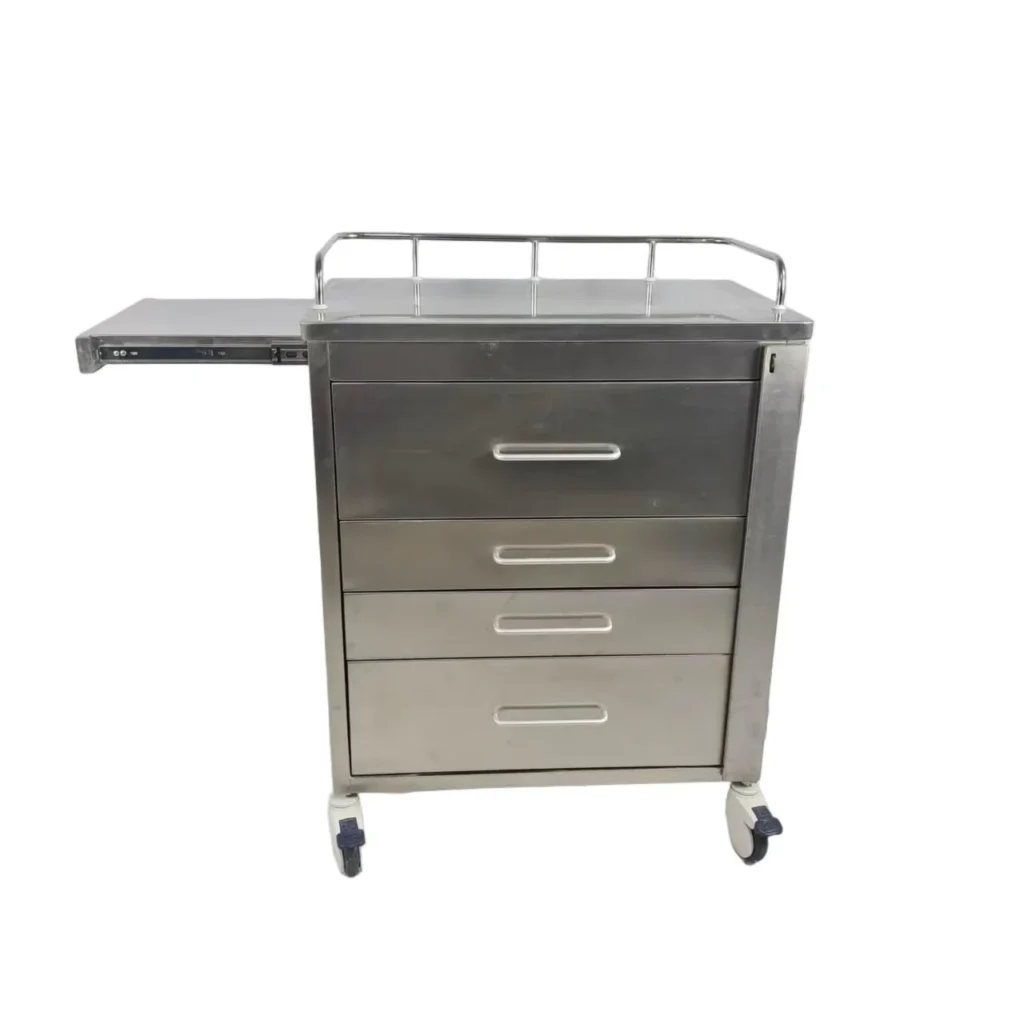A stainless steel medical cart with three drawers, side pull-out tray, top rail, and four caster wheels on a white background.
