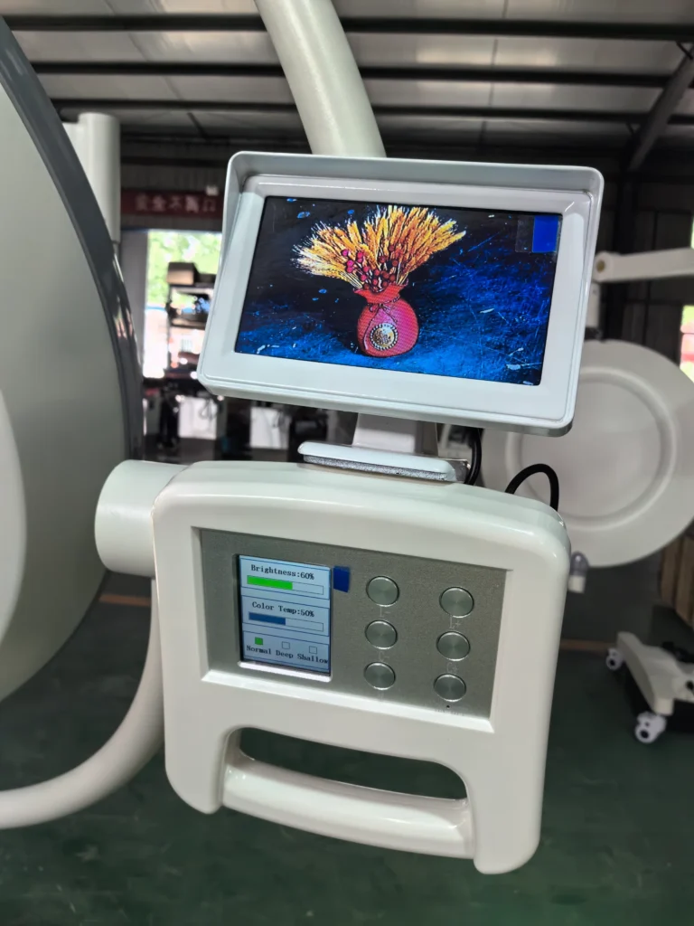 A close-up of a medical device with a display screen showing an image of a vase and wheat, alongside a control panel with buttons and brightness settings.