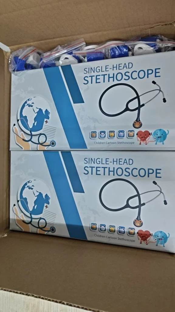 A box containing multiple single-head stethoscopes with packaging designed for children, featuring cartoon illustrations of animals and a stethoscope.