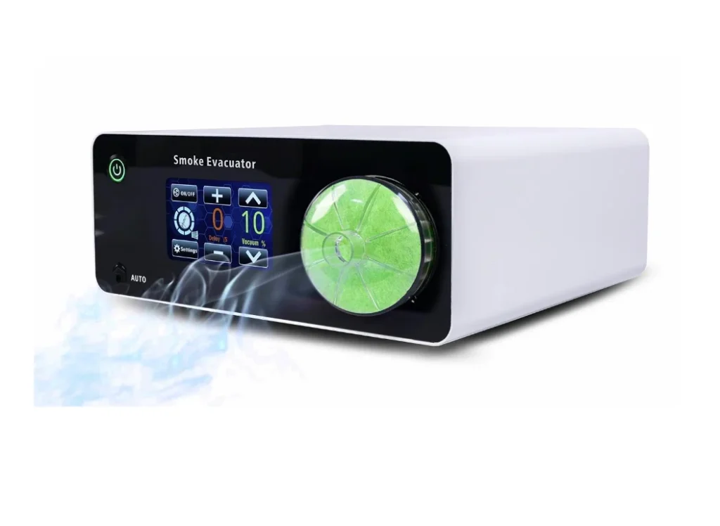 A compact smoke evacuator device with a digital display screen and a visible green filter, emitting smoke from its side.