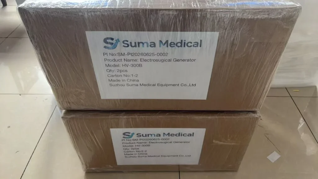 Two stacked cardboard boxes with visible labels from Suma Medical, detailing product as Electrosurgical Generator (Model: HV-300B) in a warehouse setting.