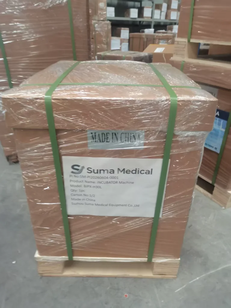Wooden crate packaging for a Suma Medical incubator machine with visible product information and 'Made in China' label.