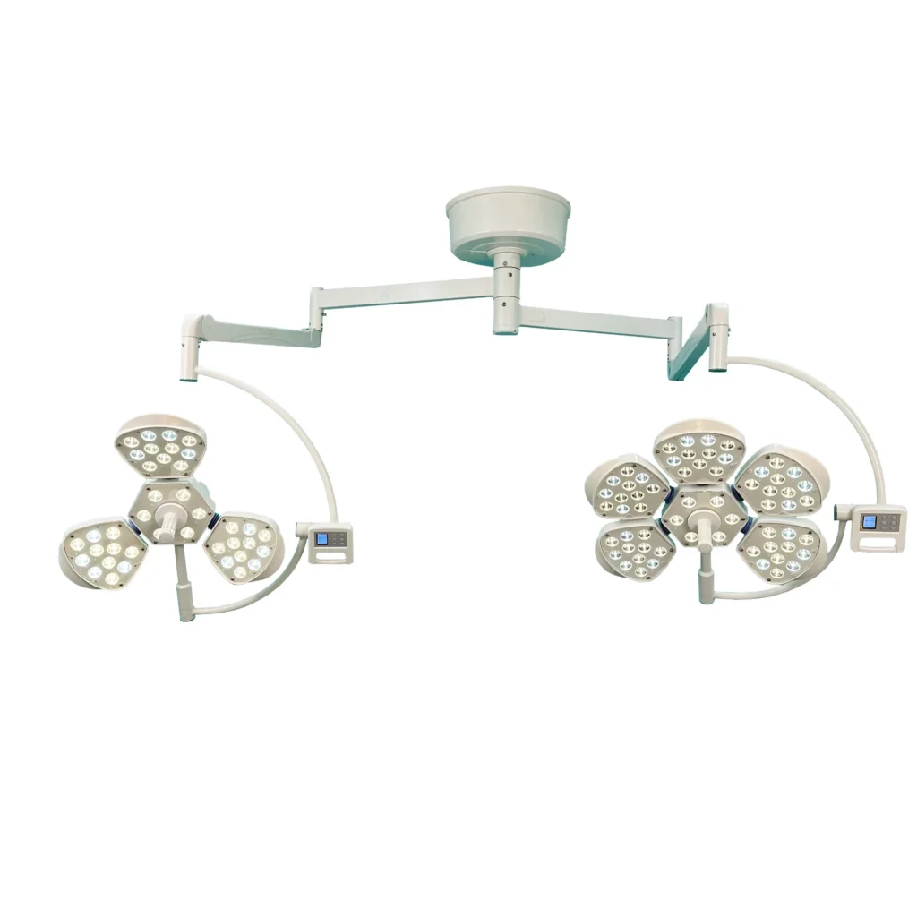 Dual adjustable ceiling-mounted surgical LED lights with multiple panels and control panels, used for medical procedures.