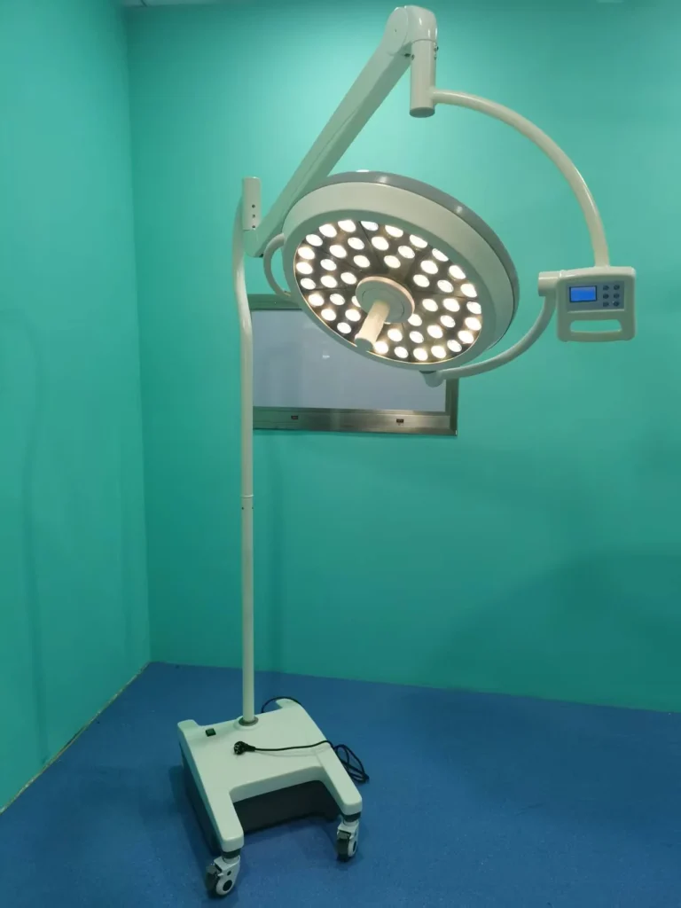 Mobile LED surgical light with adjustable arm in a teal-colored medical room.