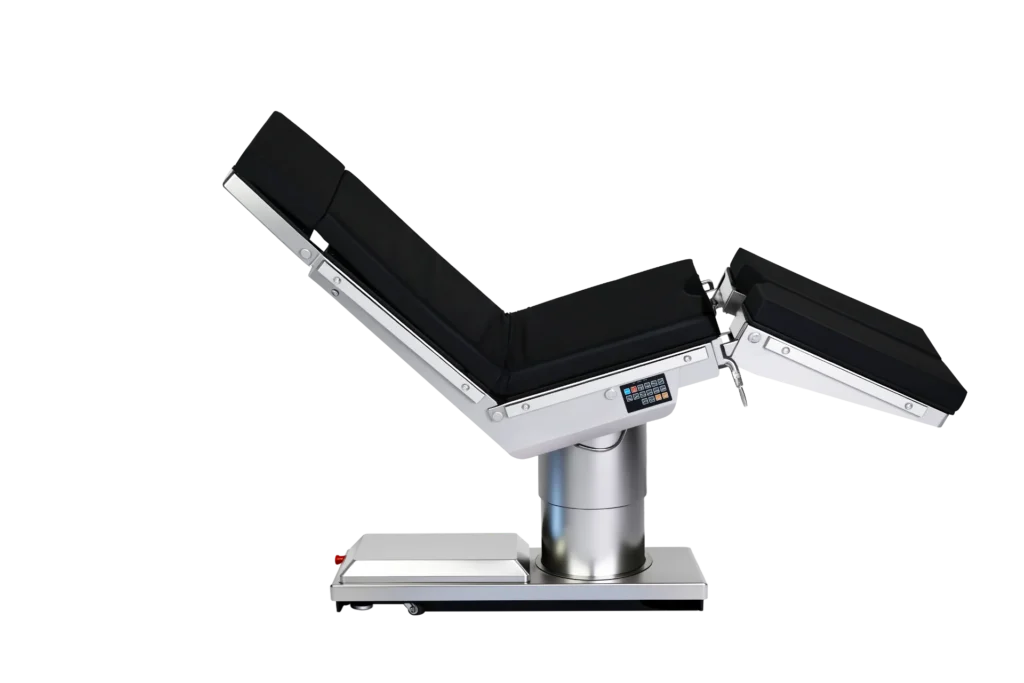 Adjustable surgical operating table with black padded sections and metallic base, featuring a digital control panel.
