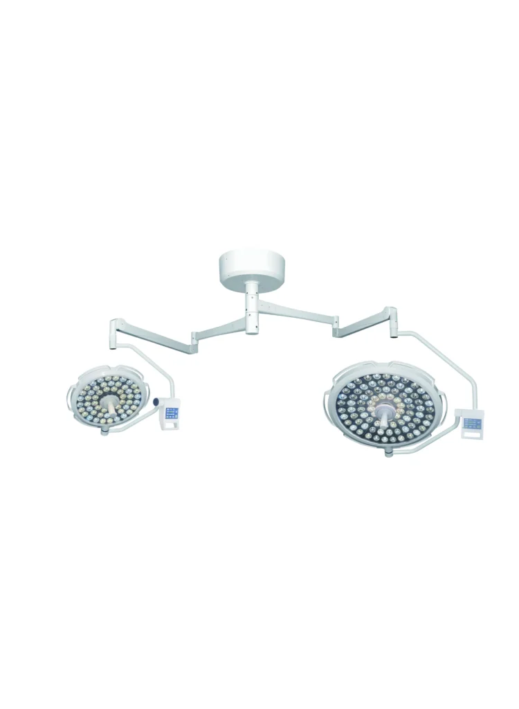 Dual ceiling-mounted surgical lights with adjustable arms and multiple LED bulbs in a medical setting.