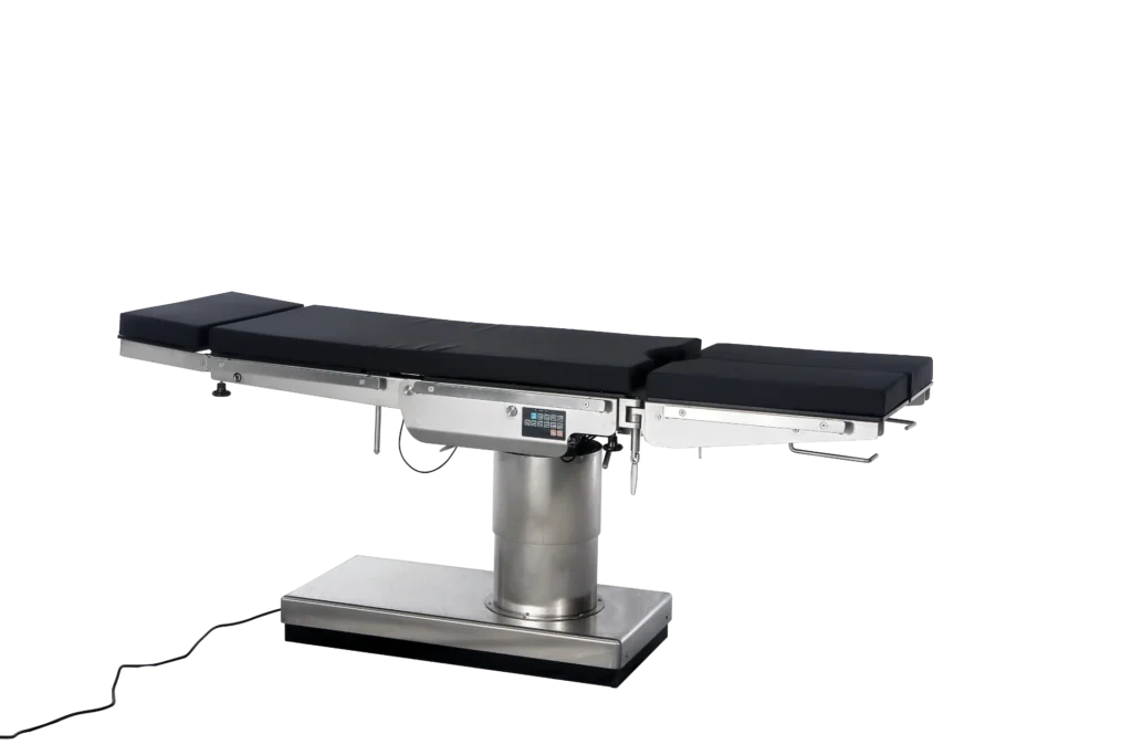 A sleek, modern surgical operating table with adjustable sections and a stainless steel base, featuring a control panel.
