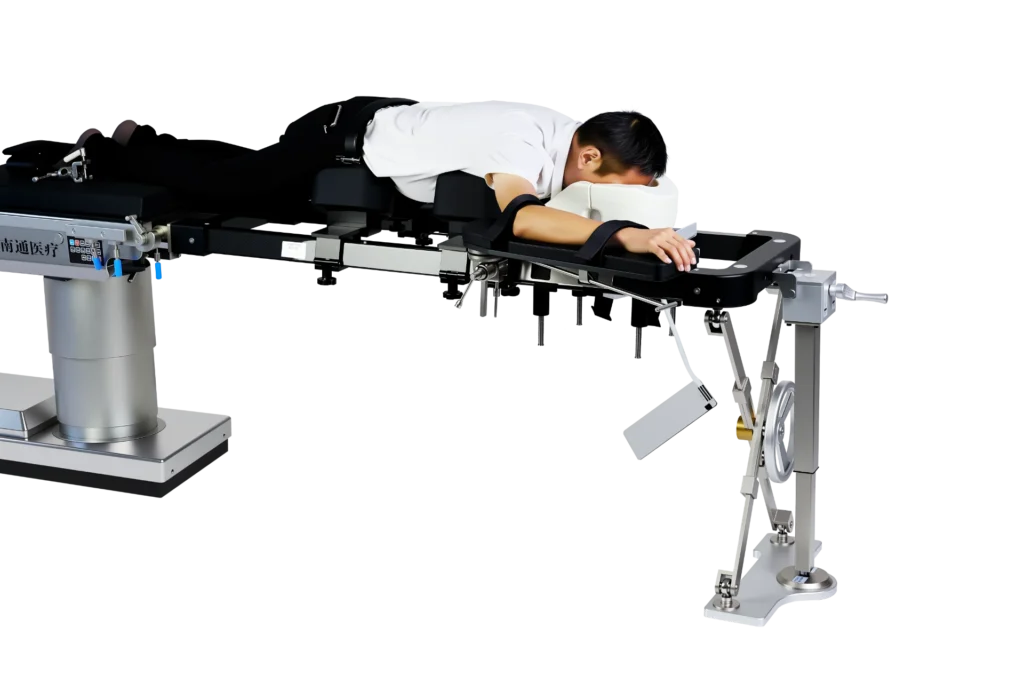 A patient lying face down on a specialized prone medical procedure table with adjustable supports and restraints.